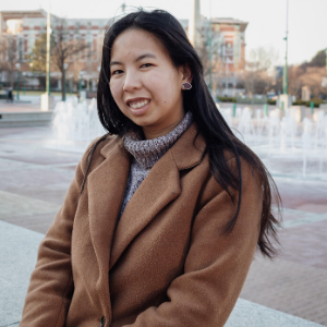 girl in front of water fountain 