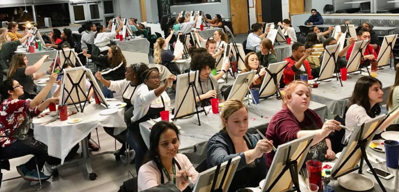 students in cone center with easels 