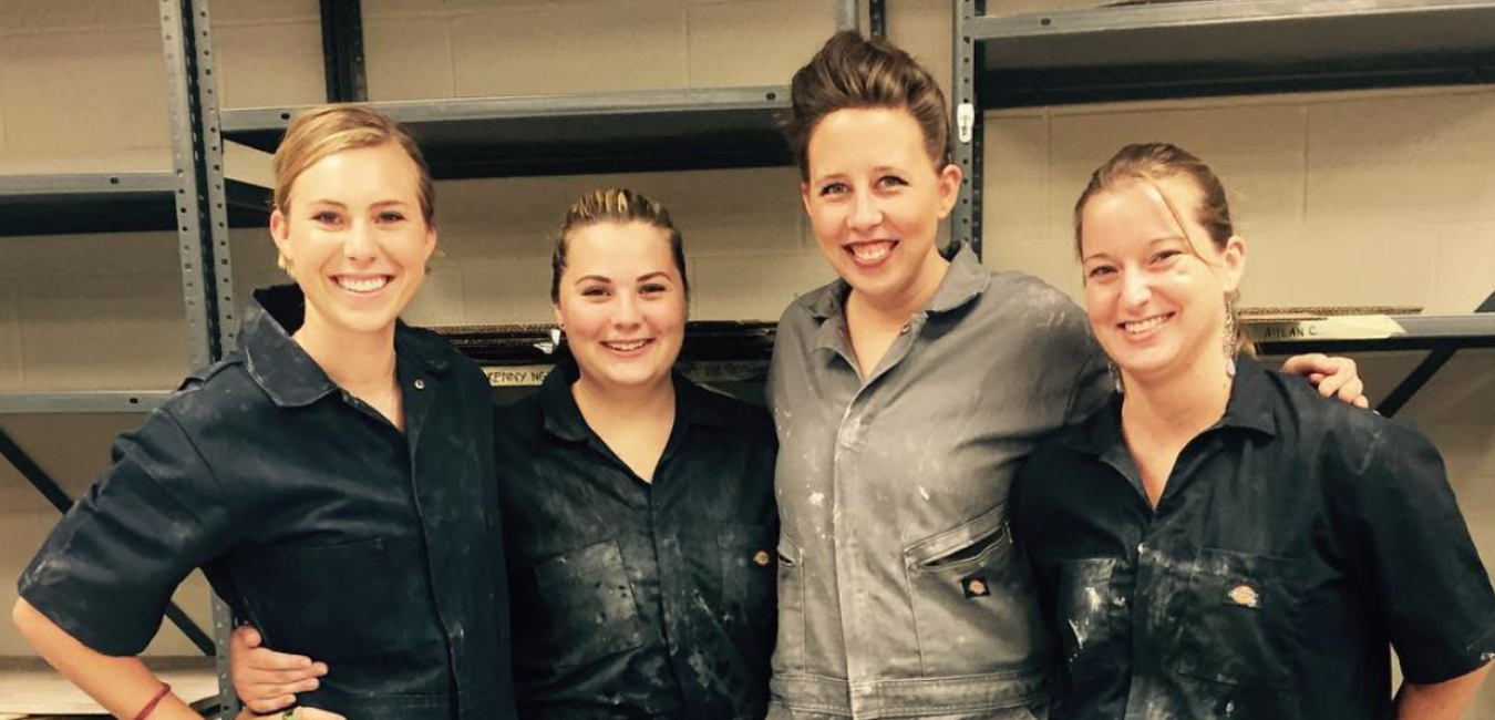 four students with smocks