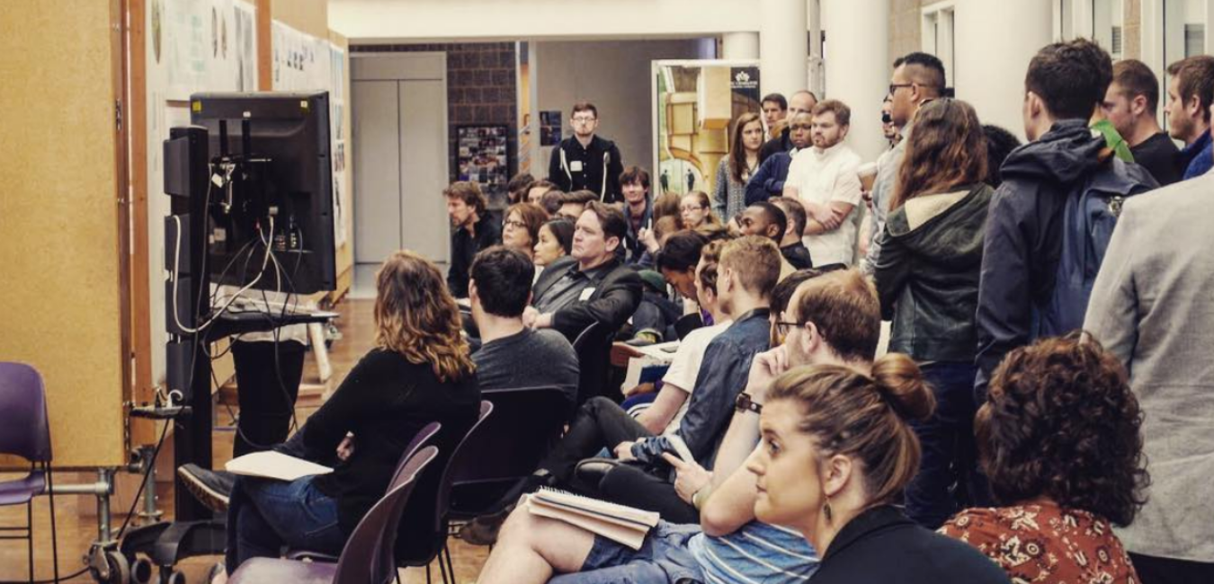 group of students watching a presentation in Storrs salon