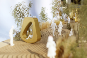 photo of model with gold spheres as chairs and trees