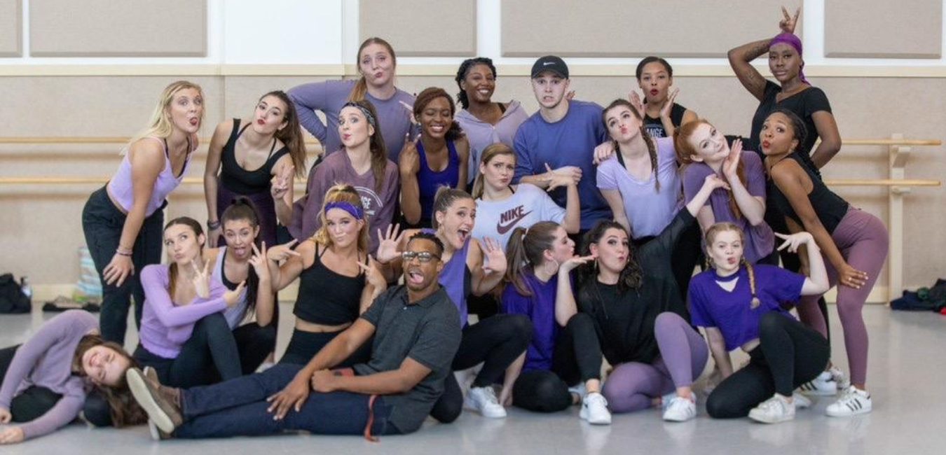 large group of dance students in a group photo before their showcase