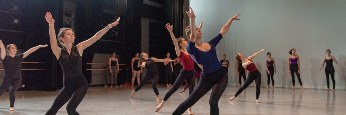 dancers in a studio doing a modern warm up