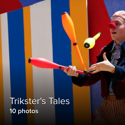 student juggling against a colorful background outside